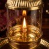 Brass_Akhand_Jyot_Diya_flame_202607121306 Handcrafted Vintage Lantern Style Pure Brass Akhand Diya with Cylindrical Glass Chimney & Fluted Brass Crown Lid