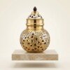 Brass_Garbo_on_marble_podium_202607151125 Handcrafted Dual-Tone Pure Brass Navratri Garbo (7 Inches / 450g) – Gold & Silver Plated Swastik & Floral Cutout Jaali Work