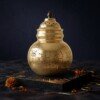 Brass_Garbo_with_oil_diya_202607151110 Heritage Pure Brass Navratri Garbo (7 Inches / 450g) – Hand-Perforated "Jay Ambe" Design with Dome Lid