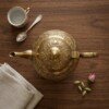 Brass_Kettle_on_walnut_table_202607121054 Royal Handcrafted Pure Brass Tea Kettle (Teapot / Ketli) – Vintage Antique Finish with Floral Relief Engravings, Swan Spout & Pedestal Base