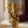 Brass_bell_with_Ganpati_idol_202607091700 Handcrafted Pure Brass Ganesha Pooja Hand Bell (12 cm / 4.72 Inches) – Traditional Carved Brass Ghanti with Lord Ganesha Finial Handle