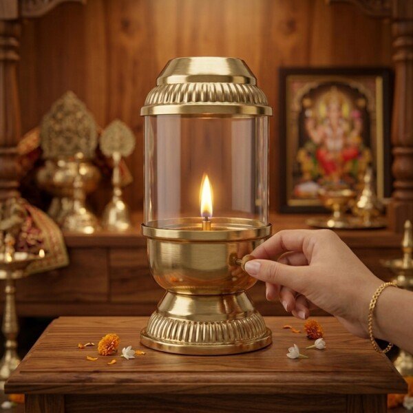 Brass_diya_rotating_wick_adjuster_202607121306 Handcrafted Vintage Lantern Style Pure Brass Akhand Diya with Cylindrical Glass Chimney & Fluted Brass Crown Lid