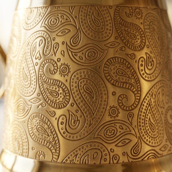 Brass_water_jug_engraving_detail_202607101017 Hira Craft Royal Paisley Engraved Pure Brass Water Pitcher with Brass Lid (1.5 Liters) – Royal Vintage Handle