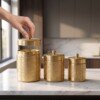 make_it_3_4_2K_202607232044 (1) Luxury Handcrafted Pure Brass Kitchen Canister Jars (Set of 3 - Small, Medium, Large) – Matte Gold Finish with Traditional Geometric Relief Engravings & Ball Knob Lids