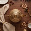 make_it_3_4_2K_202607232343 Royal Handcrafted Pure Brass Tea Kettle (Teapot / Ketli) – Vintage Antique Finish with Intricate Peacock & Floral Engravings, Curved Handle & Dome Lid